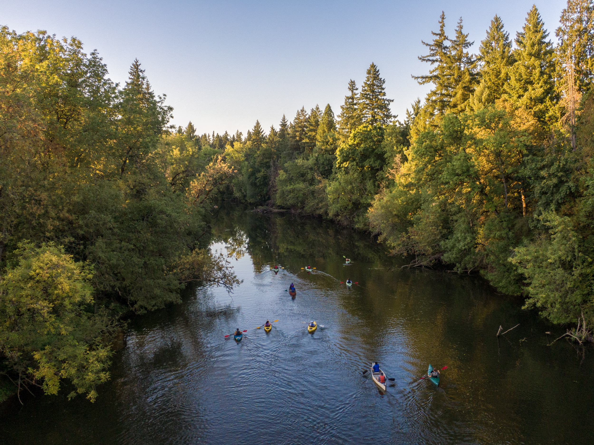 An aerial image of the Tualatin River with people canoeing.